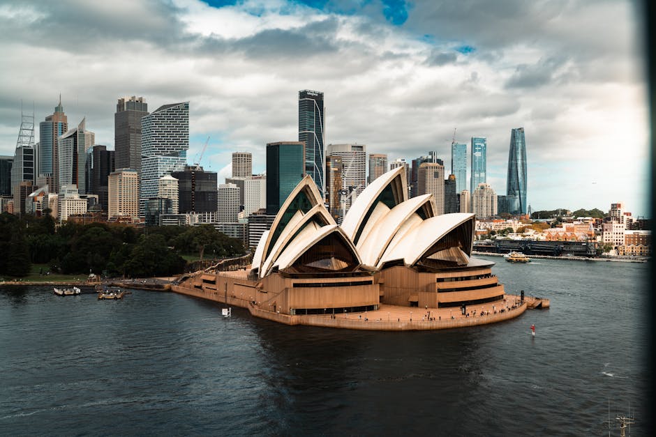 Stunning aerial view of the Sydney Opera House with the city skyline in the background.