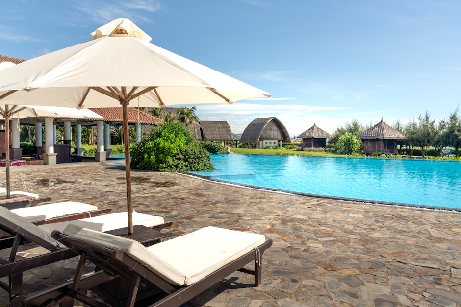 Experience a tropical paradise at this luxurious resort with a stunning pool and relaxation area.