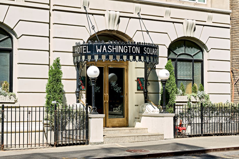 Elegant entrance of Hotel Washington Square, capturing classic New York architectural charm.