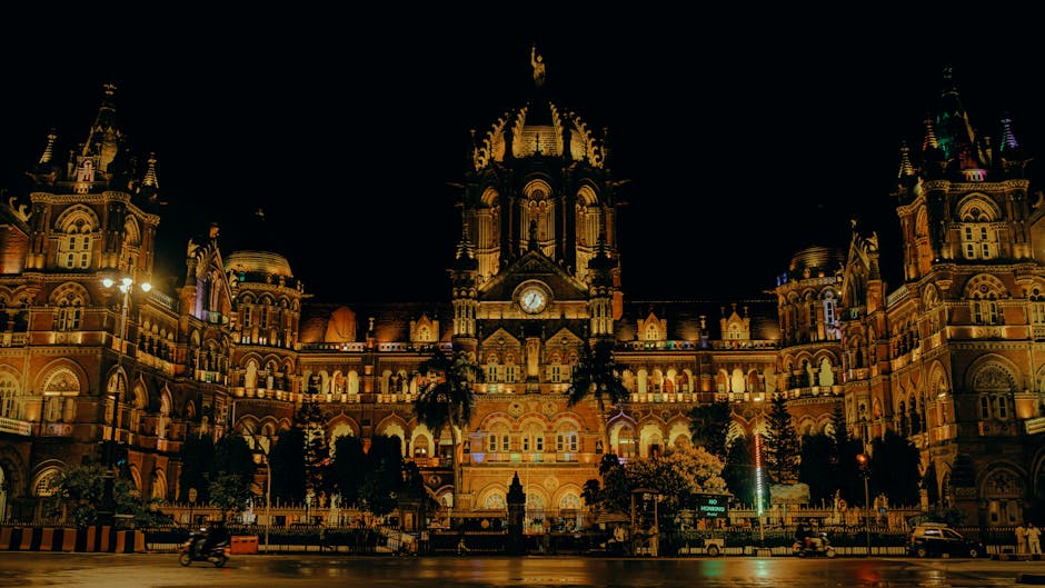 Night view of the iconic Chhatrapati Shivaji Terminus in Mumbai, beautifully lit and historic.
