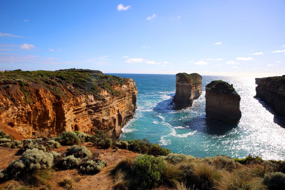 Breathtaking view of rugged coastal cliffs and rock formations along Australia's Great Ocean Road.